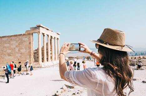 A woman taking a photo on her phone