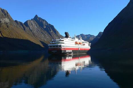 A cruise ship in a Norwegian fjord