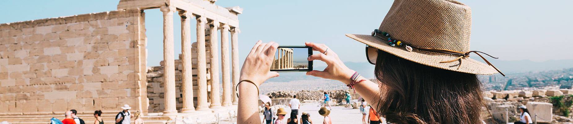 A woman taking a photo on her phone